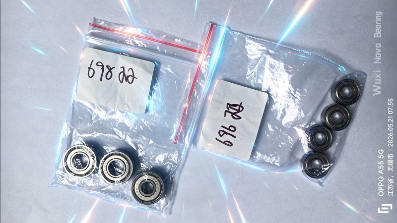 Precision miniature ball bearings on white background for industrial and electronic applications .jpg