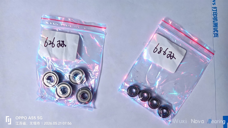 Small deep groove ball bearings for motors and consumer electronics, clean white background .png